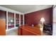 Home office with built-in shelves, a desk, and a large window offering natural light at 6100 Hunter Ln, Weddington, NC 28104