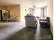 Spacious living room and dining area, offering ample space for Gathering and entertainment at 6234 Rosecroft Dr, Charlotte, NC 28215
