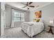 Comfortable bedroom with carpet, ceiling fan, and a window letting in natural light at 639 Lorain Nw Ave, Concord, NC 28027
