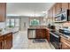 Open-concept kitchen with stainless steel appliances and a view to the living area at 639 Lorain Nw Ave, Concord, NC 28027
