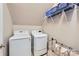 Functional laundry room with modern washer and dryer and convenient overhead shelving at 639 Lorain Nw Ave, Concord, NC 28027
