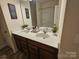 Bathroom featuring double sinks, modern fixtures, and neutral tones for a calming atmosphere at 705 Hinterland Ln, Matthews, NC 28104