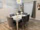 Elegant dining room with a glass-top table, velvet chairs, and decorative lighting at 705 Hinterland Ln, Matthews, NC 28104