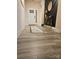 Welcoming entryway features light floors and a decorative accent wall with a gold mirror and table at 705 Hinterland Ln, Matthews, NC 28104