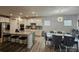 Open kitchen flows into the dining area, featuring a granite island, stainless appliances, and ample seating at 705 Hinterland Ln, Matthews, NC 28104