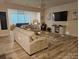 Spacious living room featuring neutral-toned sofas, modern decor, and plenty of natural light at 705 Hinterland Ln, Matthews, NC 28104