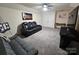 Spacious living area with comfortable seating, neutral carpet, and a bright, airy feel at 705 Hinterland Ln, Matthews, NC 28104