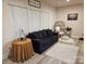 Cozy living room featuring modern decor, large windows, and comfortable seating arrangements at 705 Hinterland Ln, Matthews, NC 28104