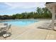 Community pool area with plenty of seating, providing a refreshing and social atmosphere at 705 Hinterland Ln, Matthews, NC 28104