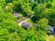 Birds eye view of lovely home surrounded by mature landscaping and lush greenery at 7122 Forest Ridge Rd, Matthews, NC 28104