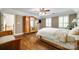 Comfortable bedroom featuring hardwood floors, natural light, and ample space at 7122 Forest Ridge Rd, Matthews, NC 28104