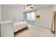 This bedroom has neutral walls, a ceiling fan, and a large double door closet at 7122 Forest Ridge Rd, Matthews, NC 28104