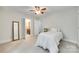 This bedroom has neutral walls, a ceiling fan, and an ensuite bathroom at 7122 Forest Ridge Rd, Matthews, NC 28104