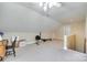 Spacious bonus room with high ceilings, carpet flooring, and plenty of natural light at 7122 Forest Ridge Rd, Matthews, NC 28104