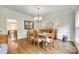 Charming dining room with classic décor, hardwood floors, and natural light at 7122 Forest Ridge Rd, Matthews, NC 28104