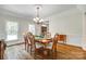 Bright dining room features classic furniture, with a seamless transition to other rooms at 7122 Forest Ridge Rd, Matthews, NC 28104