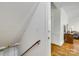 Elegant hallway with wood flooring, traditional trim, and staircase with wooden banister at 7122 Forest Ridge Rd, Matthews, NC 28104