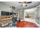 Well-lit home office features hardwood floors, built-in desk, and adjacent bonus room at 7122 Forest Ridge Rd, Matthews, NC 28104