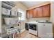 Functional laundry room with ample storage shelves and modern washer and dryer at 7122 Forest Ridge Rd, Matthews, NC 28104