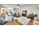 Open-concept living room with hardwood floors, a fireplace, and ample seating at 7122 Forest Ridge Rd, Matthews, NC 28104