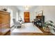 Sophisticated living room with piano, built-ins, and ample natural light at 7122 Forest Ridge Rd, Matthews, NC 28104