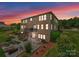 Spacious backyard features a patio with a fire pit and outdoor seating, a deck and landscaped grounds at 733 Lingfield Ln, Waxhaw, NC 28173
