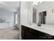 Bathroom features a dark wood vanity with a white countertop and a frameless mirror at 733 Lingfield Ln, Waxhaw, NC 28173