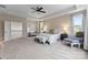 Bright bedroom features neutral tones, a tray ceiling, and access to additional living space at 733 Lingfield Ln, Waxhaw, NC 28173