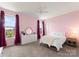 Bright bedroom with two windows, white dresser, and a queen bed with a cozy throw blanket at 733 Lingfield Ln, Waxhaw, NC 28173