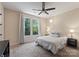 Cozy bedroom with neutral tones, a ceiling fan, and a view of the backyard at 733 Lingfield Ln, Waxhaw, NC 28173
