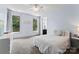 Sun-filled bedroom with two large windows and a comfortable bed, offering a relaxing retreat at 733 Lingfield Ln, Waxhaw, NC 28173