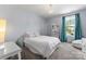 Charming bedroom features a queen-sized bed, plush carpet, and window with ample natural light at 733 Lingfield Ln, Waxhaw, NC 28173