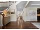 Elegant foyer with hardwood floors, decorative wainscoting and trim with a view to the living room at 733 Lingfield Ln, Waxhaw, NC 28173