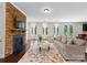 Inviting living room featuring a stone fireplace, hardwood floors and natural lighting at 733 Lingfield Ln, Waxhaw, NC 28173