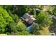 Expansive aerial view of a charming home nestled among lush greenery with a detached garage at 8222 Henry Harris Rd, Fort Mill, SC 29707