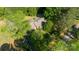 Aerial view showcasing a well-maintained home with lush trees and landscaping, situated on a spacious lot at 8222 Henry Harris Rd, Fort Mill, SC 29707