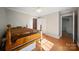 Bedroom featuring hardwood floors, ceiling fan, and access to a closet at 8222 Henry Harris Rd, Fort Mill, SC 29707