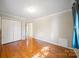 Bright bedroom with hardwood floors and spacious closet at 8222 Henry Harris Rd, Fort Mill, SC 29707