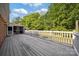 Large wooden deck overlooking a lush green backyard, perfect for outdoor entertaining at 8222 Henry Harris Rd, Fort Mill, SC 29707