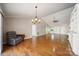 Spacious living room with hardwood floors, a ceiling fan, and lots of natural light at 8222 Henry Harris Rd, Fort Mill, SC 29707