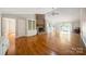 Bright living room with hardwood floors, a brick fireplace, built-in bookshelves, and sliding doors at 8222 Henry Harris Rd, Fort Mill, SC 29707