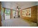 Screened porch with brick walls, ceiling fan, and access to the backyard at 8222 Henry Harris Rd, Fort Mill, SC 29707