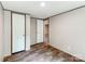 Spacious bedroom with ample lighting, featuring wood-look floors and access to adjacent rooms at 850 Deep Hollow Ct, Clover, SC 29710