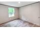 Bedroom with a view and a wood-look floor offers a comfortable and naturally lit space at 850 Deep Hollow Ct, Clover, SC 29710