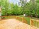New wooden deck overlooks a spacious backyard with mature trees at 850 Deep Hollow Ct, Clover, SC 29710