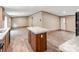 Kitchen with a large island, wood-look flooring, and modern fixtures, leading into an open-concept living area at 850 Deep Hollow Ct, Clover, SC 29710