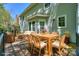 Back deck featuring outdoor seating, a dining table, and access to the home at 8709 Stratton Farm Rd, Huntersville, NC 28078