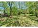 Well-manicured backyard with fire pit and a beautiful view at 8709 Stratton Farm Rd, Huntersville, NC 28078