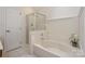 Bathroom with corner tub and a separate shower with glass door and white marble surround at 8709 Stratton Farm Rd, Huntersville, NC 28078