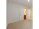 Empty bedroom featuring carpet floor and attached bathroom at 8709 Stratton Farm Rd, Huntersville, NC 28078